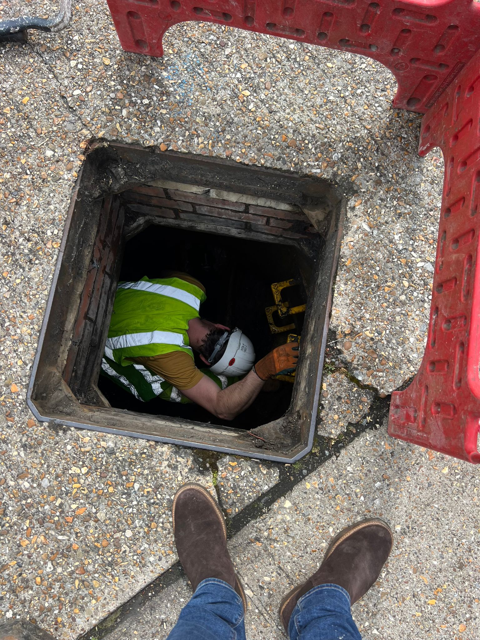 Deep Rooted Drain Unblocking - a man deep in a drain - A Drainage Company